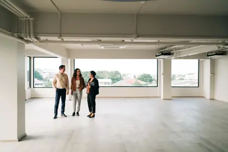 female real estate agent showing spacious office