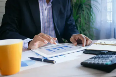 guy looking at business report