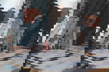 building models and a business meeting