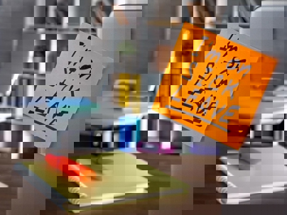 I'm on sick leave sticky note on desk