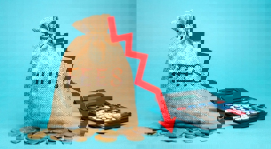 a sack full of money that says fees next to a calculator