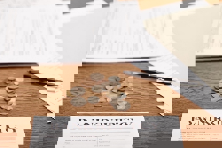 change on the table with bankruptcy paperwork