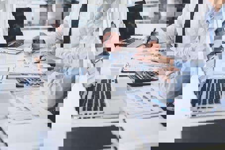 working on laptops and going over paperwork