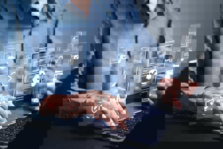 working on laptop with graphics floating